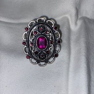 Silver stretchy ring w/purple jewel accents 100